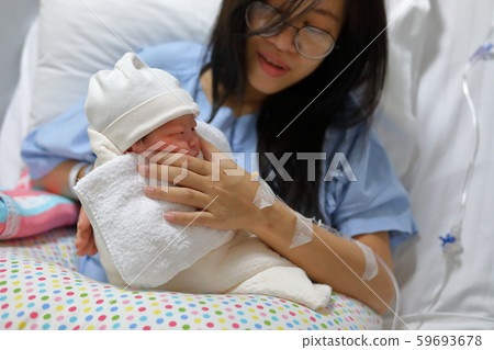 mother parenting, mom using hand help a baby newborn belch burping after breastfeeding milk mother parenting, mom using hand help a baby newborn belch burping after breastfeeding milk 59693678