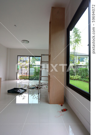 interior home office renovation, furniture built in with plywood material installing in a new house 59694072