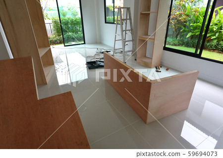 interior home office renovation, furniture built in with plywood material installing in a new house 59694073