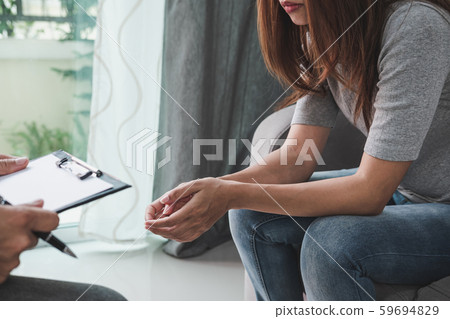 Professional psychologist doctor holding clipboard 59694829