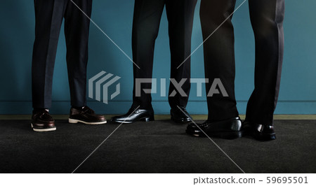 Three Businessman Standing by the Wall. 3 Business 59695501