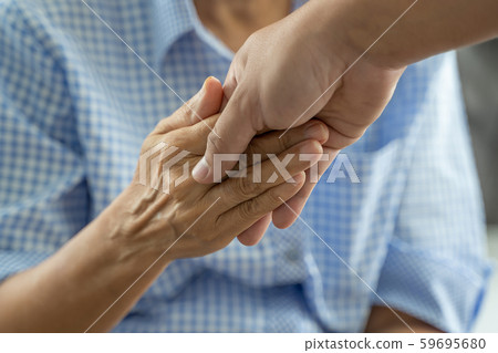 people old woman and young hand holding Disabled people old woman and young hand holding Disabled 59695680