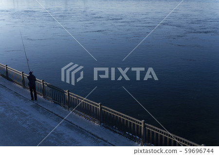 Man fishing in blue river, landscape photography Man fishing in blue river, landscape photography 59696744