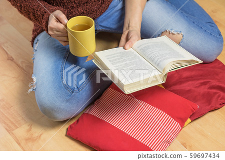Aerial view of woman sitting down on the floor Aerial view of woman sitting down on the floor 59697434