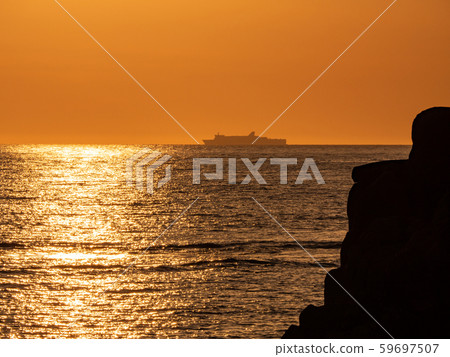 Echizen Kaga Kaigan Quasi-National Park, Tojinbo evening view, large passenger boat silhouette Echizen Kaga Kaigan Quasi-National Park, Tojinbo evening view, large passenger boat silhouette 59697507