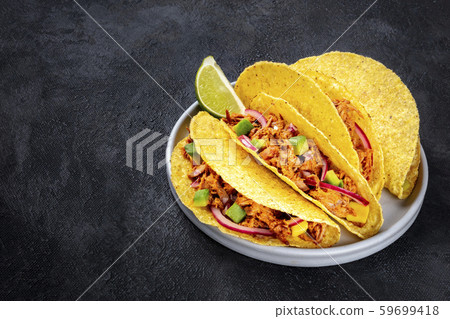 Cochinita pibil taco shells, a Mexican snack with 59699418