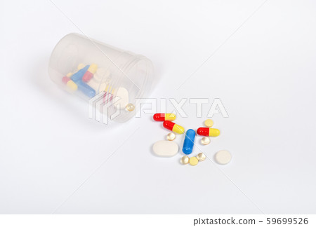 Transparent glass with different pills or drugs 59699526