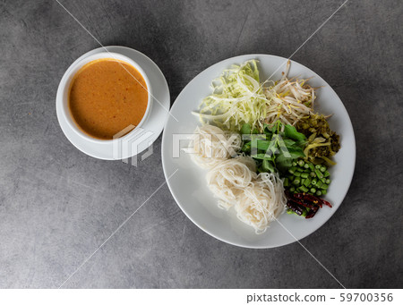 Rice noodles with fish curry sauce served with 59700356