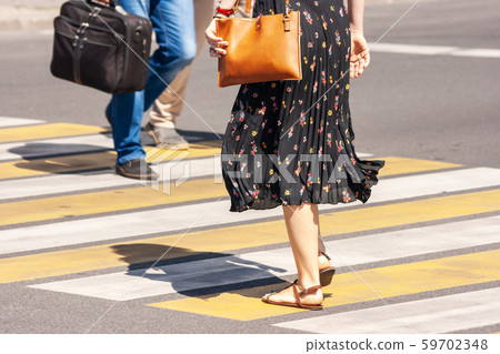 pedestrians crossing the street pedestrians crossing the street 59702348