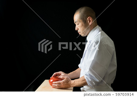 In front of the plate that covers the bowl In front of the plate that covers the bowl 59703914