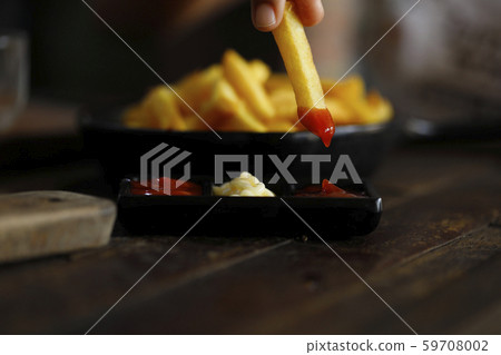 French fries with many flavors of sauce. French fries with many flavors of sauce. 59708002