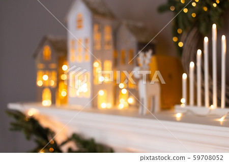 Closeup of Xmas decorations standing in a row on fireplace. Blured photo 59708052