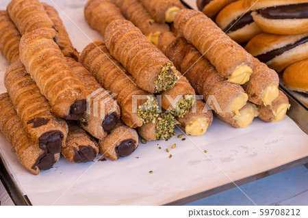 Cannoli italian cake on a shelf Cannoli italian cake on a shelf 59708212