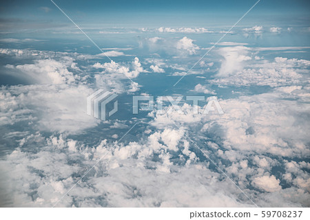 Beautiful View Of Fluffy Clouds In Sky From Height Flight Of Plane. Natural Background. Beautiful View Of Fluffy Clouds In Sky From Height Flight Of Plane. Natural Background. 59708237