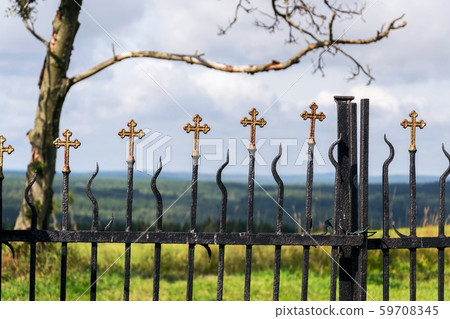 Beautiful small iron crossed fence decoration, graveyard gate with green woods, life and death Beautiful small iron crossed fence decoration, graveyard gate with green woods, life and death 59708345
