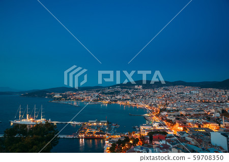 Kusadasi, Aydin Province, Turkey. Waterfront And Kusadasi Cityscape In Summer Evening. Night Scenic 59708350