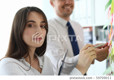 Pretty female colleague in office 59709011