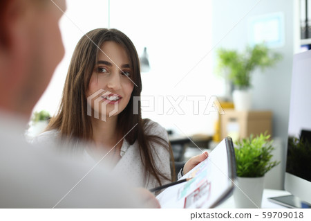 Businesslady talking with customer Businesslady talking with customer 59709018