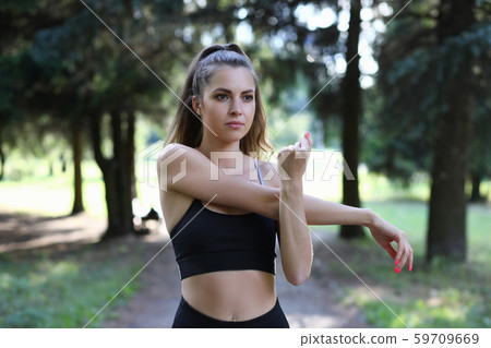 Pretty girl having sport in park 59709669