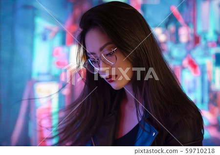 Asian Woman in the City at Night. Asian Woman in the City at Night. 59710218