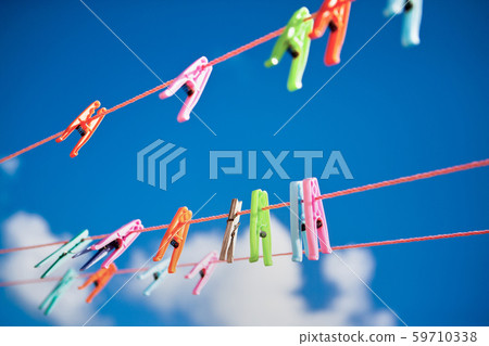 Multi-colored clothespins, in the Dominican Republic. sunny positive image 59710338