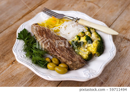 Grilled cooked beef meat, broccoli, vegetable Grilled cooked beef meat, broccoli, vegetable 59711494