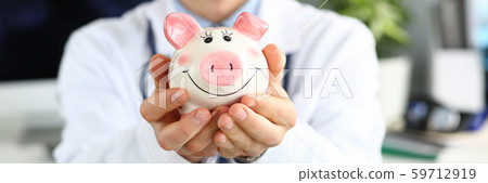 Smiling doc with thrift-box Smiling doc with thrift-box 59712919