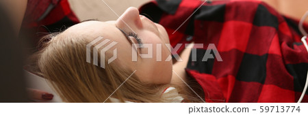 woman listen music lie on sofa woman listen music lie on sofa 59713774