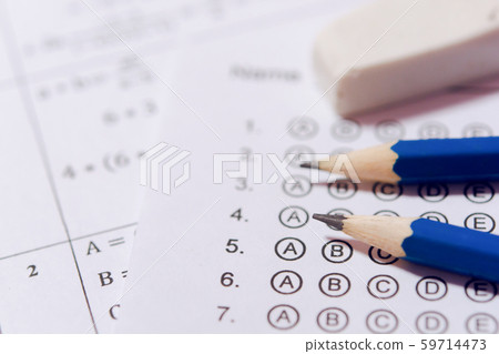 Pencil and eraser on answer sheets or Standardized 59714473