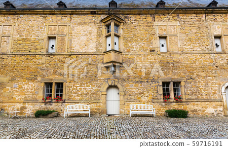 Benches in yard, ancient European tourist city 59716191