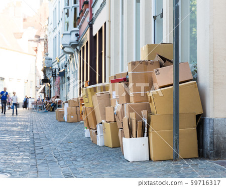 Carton garbage boxes on sidewalk, european city Carton garbage boxes on sidewalk, european city 59716317