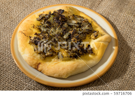Homemade cebularz, Traditional Polish pancake with onion and common poppy seeds, from Jewish tradition, baked in Lublin, Poland. 59716706