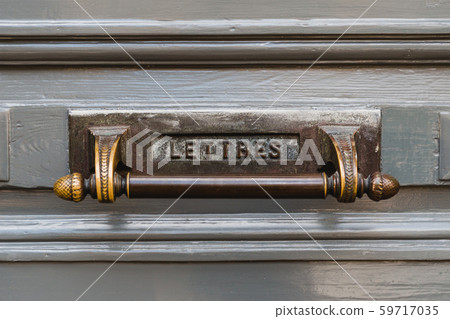 Letterbox with a gray door background. Close-up View of a Beautiful Letter Box with knob Letterbox with a gray door background. Close-up View of a Beautiful Letter Box with knob 59717035