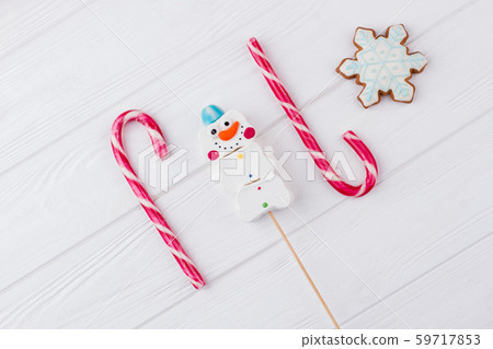 Winter holidays sweets on wooden background. Winter holidays sweets on wooden background. 59717853