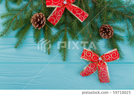 Fir branches with cones and red bows. Fir branches with cones and red bows. 59718025