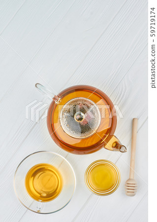Teapot, honey and cup of tea. Teapot, honey and cup of tea. 59719174