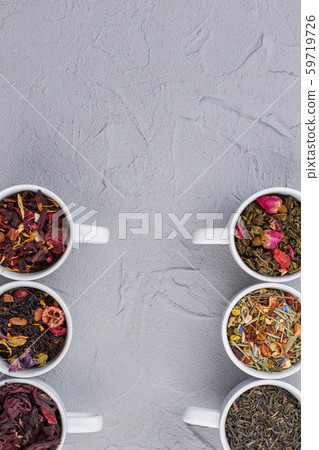Assorted dry tea in cups and copy space. Assorted dry tea in cups and copy space. 59719726