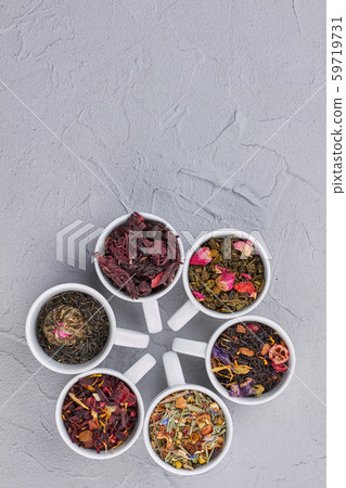 Mix of dry tea in cups and copy space. Mix of dry tea in cups and copy space. 59719731