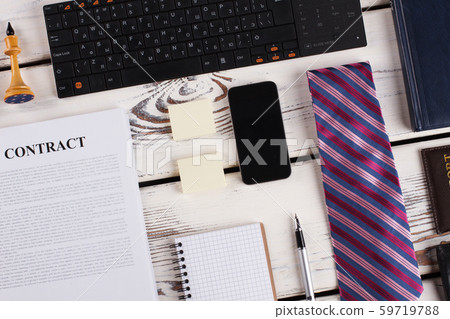 Tie, smartphone and keyboard. Tie, smartphone and keyboard. 59719788
