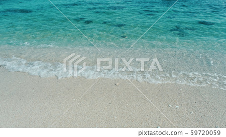 Emerald green water. Beautiful background transparent surface wave, sand on clean beach. Royalty high-quality free stock photo image of clean surface seawater, waves on the beach with sand in sunshine Emerald green water. Beautiful background transparent surface wave, sand on clean beach. Royalty high-quality free stock photo image of clean surface seawater, waves on the beach with sand in sunshine 59720059