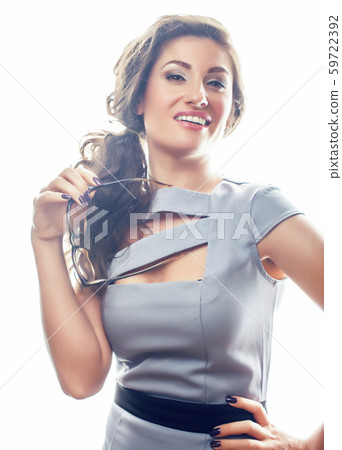 young pretty real brunette woman secretary in gray dress wearing glasses isolated on white 59722392