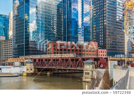 Chicago River walk with Yacht running and traing running over the rail track, illinois, USA. Business Architecture and building with tourist concept 59722398