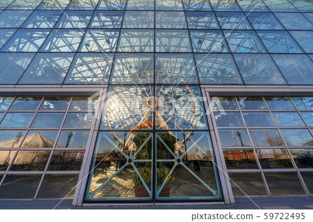 Navy pier ferris wheel reflection with windows glasses at the sunset time,Illinois, United States, USA, Business Architecture and building with tourist concept 59722495