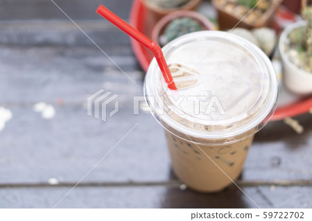 Close up glass of ice cappuccino coffee on wood Close up glass of ice cappuccino coffee on wood 59722702