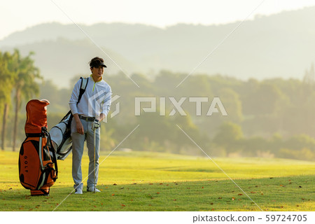 Professional Golfer asian man walking in fairway Professional Golfer asian man walking in fairway 59724705