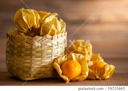 Cape gooseberry in bamboo basket. Concept of health care or herb. Closeup and copy space for text. 59725665