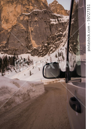 Travel by car along a serpentine uphill. 59727351