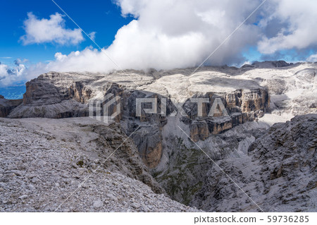 The Sass Pordoi is a relief of the Dolomites, in the Sella group, Italy The Sass Pordoi is a relief of the Dolomites, in the Sella group, Italy 59736285