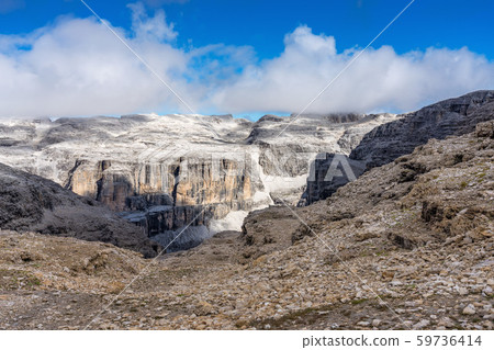 The Sass Pordoi is a relief of the Dolomites, in the Sella group, Italy The Sass Pordoi is a relief of the Dolomites, in the Sella group, Italy 59736414
