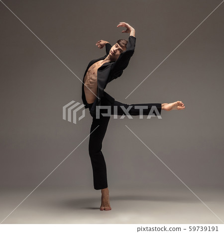 Man in casual office style clothes jumping isolated on studio background Man in casual office style clothes jumping isolated on studio background 59739191